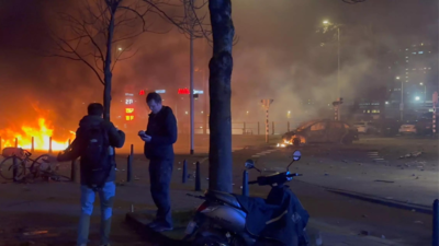Netherlands riots: Police cars torched as rival groups of Eritreans clash