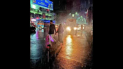 Late-evening rain lashes city
