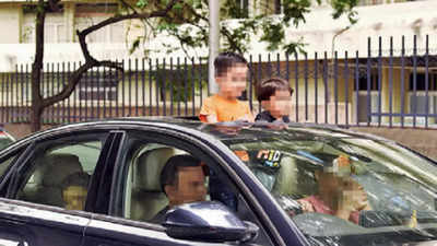 Sunroof, not safety proof: Pop out of moving car and pay fine