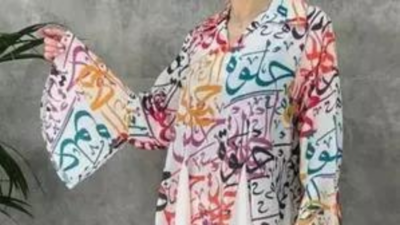 Woman in Arabic-script dress saved from mob in Pakistan
