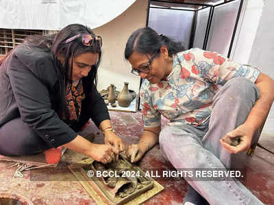 Participants learn the intricacies of Molela art at a workshop