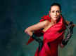 
Malaika Arora commands attention in a dramatic red gown with black opera gloves
