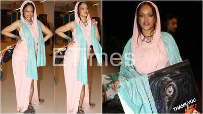 Rihanna takes an early morning flight out of Jamnagar; cheerfully poses with the paparazzi at the airport