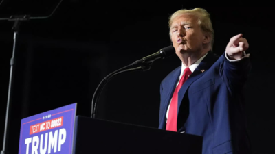 Trump escalates his immigration rhetoric with baseless claim about Biden trying to overthrow the US