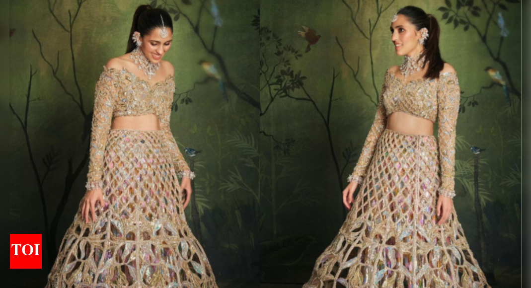 Shloka Ambani stuns in a golden lehenga with maximalist accessories at ...