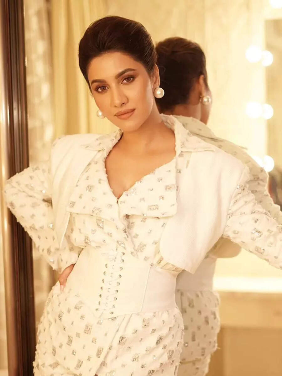 Rukmini Maitra shines bright in white ensemble adorned with golden ...