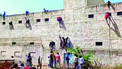 In Haryana's Nuh, youths rappel up school walls with answers during exam