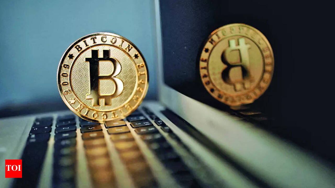 Bitcoin hits $70,000 for first time: A new era or speculative surge? -  Times of India