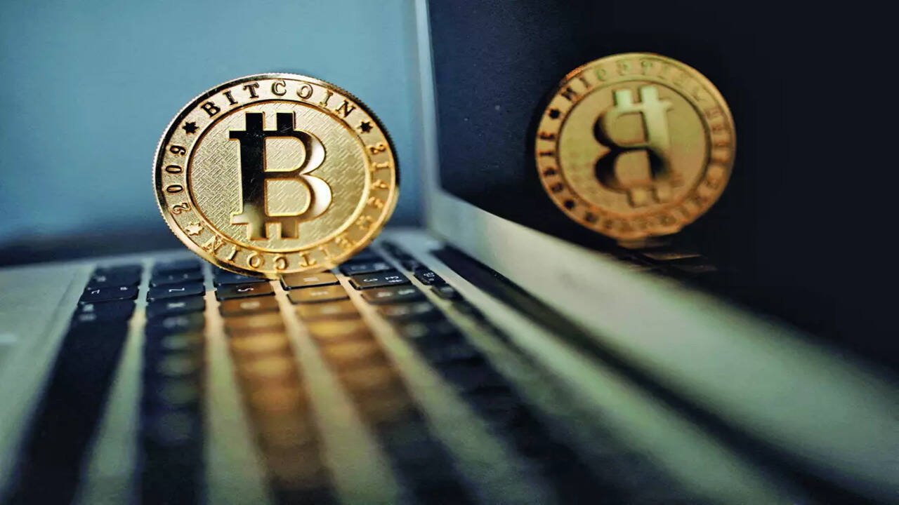 Bitcoin hits $70,000 for first time: A new era or speculative surge? -  Times of India