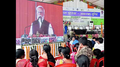 PM Modi launches light house project in city, hand over keys