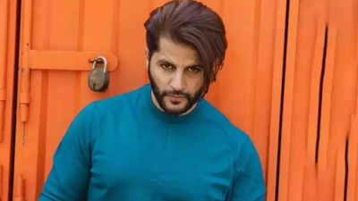 Karanvir Bohra takes his styling game a notch higher; sports silk bathrobe and shorts in ‘Honey Trap Squad 2’