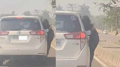 On cam, UP woman caught clinging to moving car's door