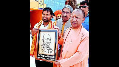 Odisha artist presents CM Yogi Adityanath’s portrait to him