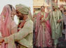 Bride and groom Kriti Kharbanda-Pulkit Samrat stun in blush pink and mint green wedding attire by Anamika Khanna