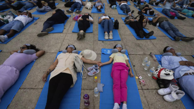 Hundreds of people in Mexico City stretch out for a 'mass nap' to commemorate World Sleep Day