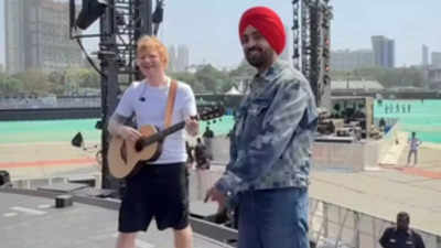 Diljit Dosanjh and Ed Sheeran performs to Lover, Shape of You on stage during Mumbai concert