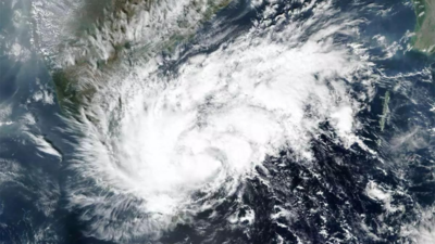 Cyclone weakens to a tropical low while bringing rain and wind to Australia's northern coast