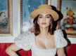 
Sonam Kapoor serves timeless and classy look in ankle-length white dress with a beige hat
