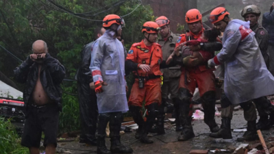 A girl in Brazil recused from rubble after 16 hours as storm kills at least 12