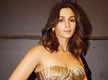 
Alia Bhatt raises the glam bar in a structured gold corset top and denim jeans
