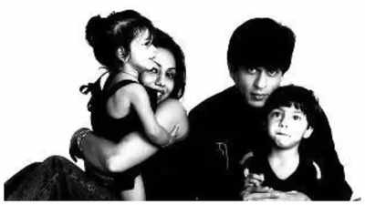 Suhana Khan hugs Gauri Khan sweetly and Aryan Khan sits playfully on Shah Rukh Khan's lap in this black-and-white throwback family photo