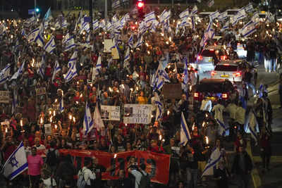 Divided by politics, Israelis unite to defy global isolation
