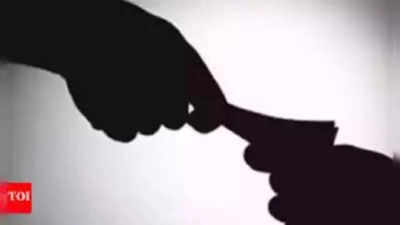 2 power co. officials caught taking bribe
