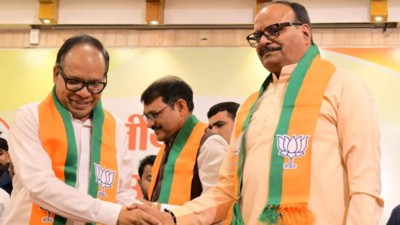 Former UP DGP, wife join BJP