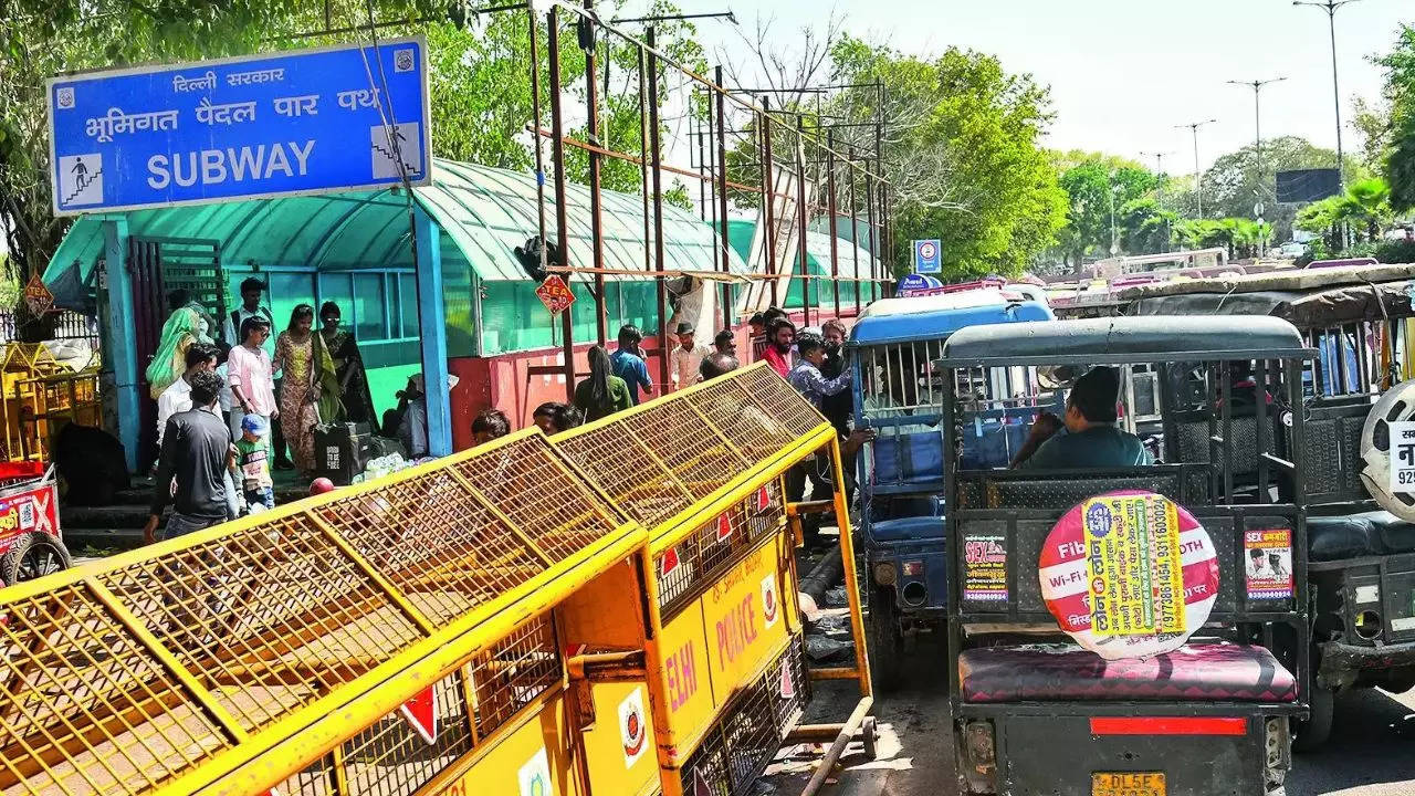 Encroached Footpaths: Not A Cakewalk: Encroached Footpaths, Dirty Subways  Plague Pedestrians | Delhi News - Times of India