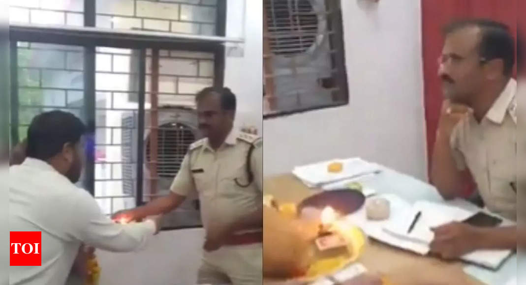 On cam: Frustrated over inaction, woman performs aarti at MP police ...