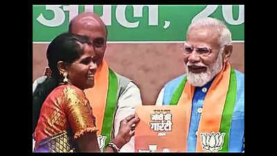 PM presents manifesto to Bastar's daughter Neelavati Maurya