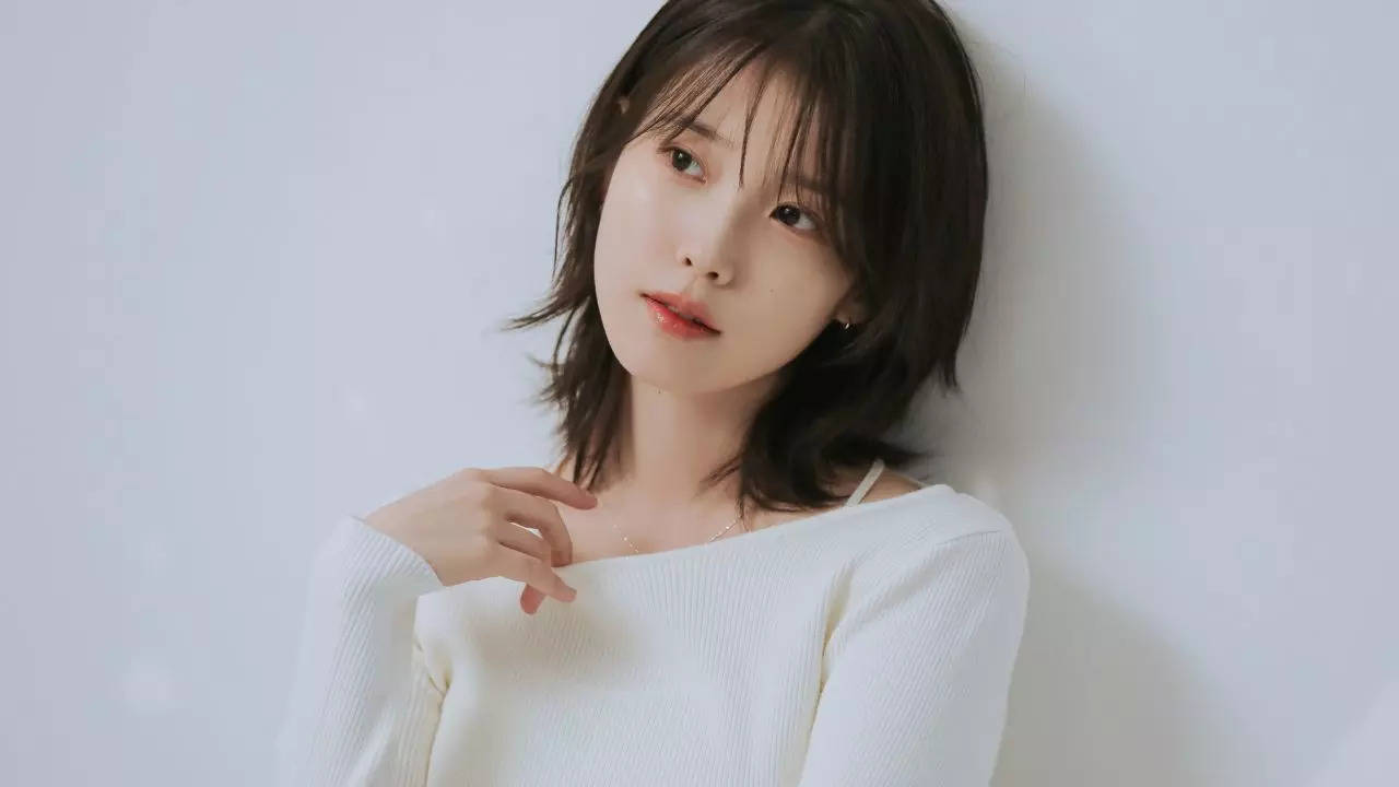 IU makes K-Pop history: 1st female soloist to reach 100 million views with  9 MVs | K-pop Movie News - Times of India