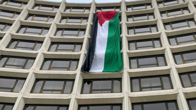 Protesters drape huge Palestinian flag at venue of White House Correspondents' Dinner