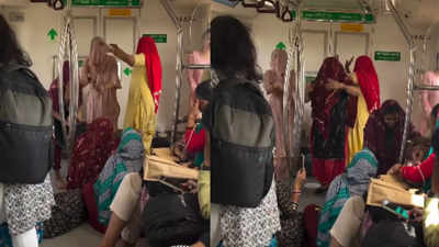 'Better than fighting': Women with ghoonghat sing & dance in Delhi Metro
