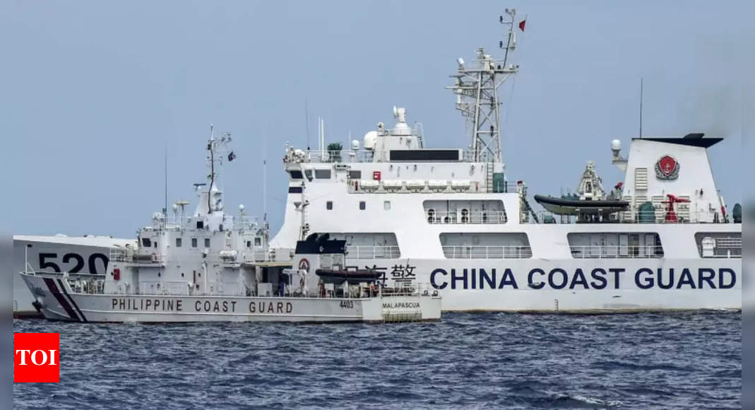 Philippines says China Coast Guard fired water cannon at its vessels – Times of India