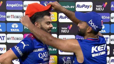 Watch: What Virat Kohli did after receiving the Orange Cap from RCB teammate Dinesh Karthik
