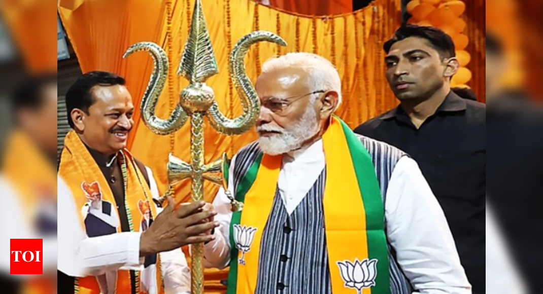 PM Modi greets BJP candidate Ramesh Awasthi in heartwarming encounter during Kanpur roadshow | India News – Times of India