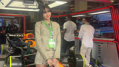 BLACKPINK's Lisa waves the checkered flag and engages with racers at the F1 Miami Grand Prix