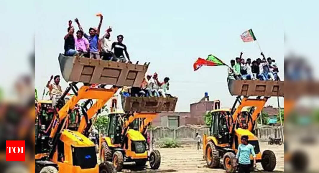 Yogi Adityanath: Bulldozer Break Dance at Yogi Election Rally in ...