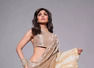 Shilpa sets the bar high in a metallic gold saree