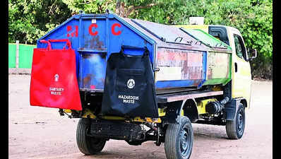 Garbage vans to collect sanitary & hazardous waste in red, black bags