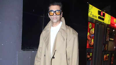 Karan Johar turns heads at Mumbai airport in a stylish trench coat