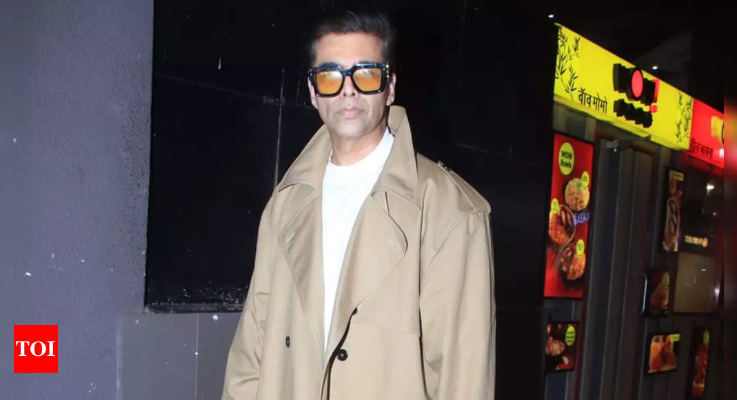 KJo turns heads at airport in a trench coat