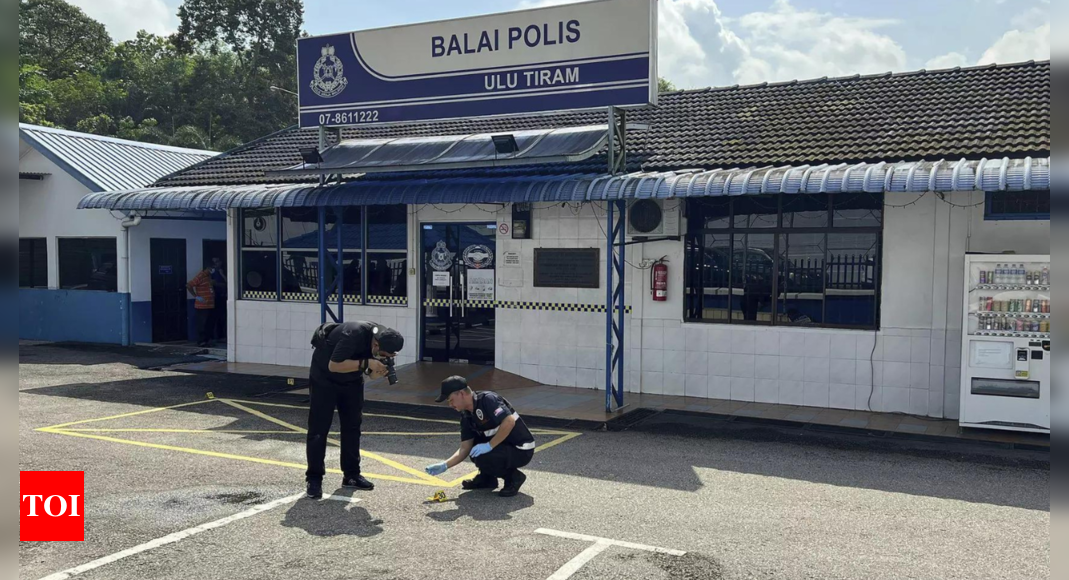 A man in Malaysia who killed 2 police officers acted on his own, a minister says