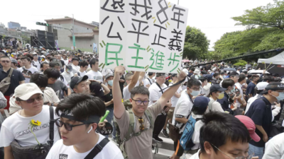 Thousands protest against contentious Taiwan parliament reforms - Times ...