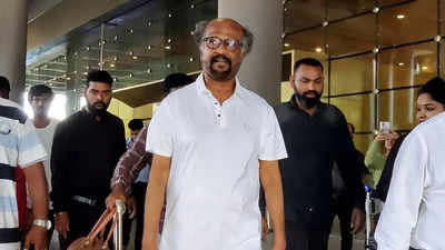 Rajinikanth returns from Abu Dhabi; poses cool with fans at the Chennai airport
