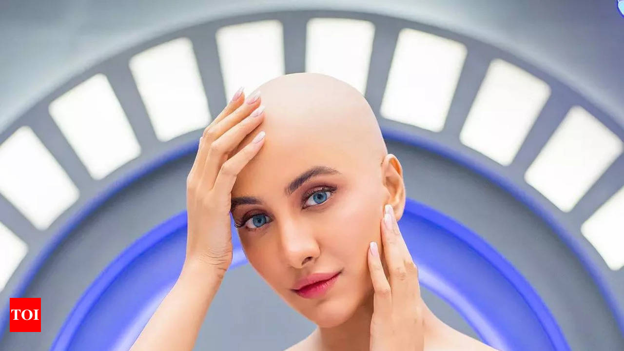 Rukmini stuns fans with bold bald look for her upcoming sci-fi comedy -  Times of India