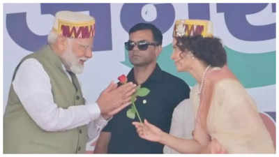 PM Narendra Modi campaigns for Kangana Ranaut in Mandi; actress greets him with a rose - See photos