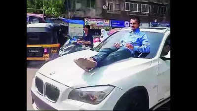 Minor drives dad’s BMW on busy road with youth perched on bonnet in Maharashtra