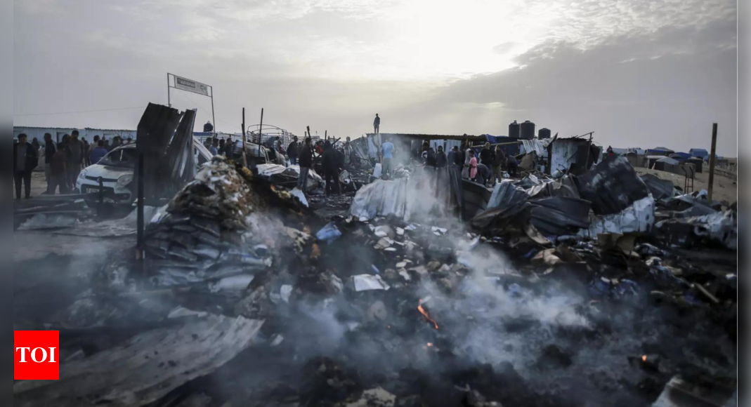 Gaza civil defence says new Israel strike kills 21 in west Rafah camp – Times of India